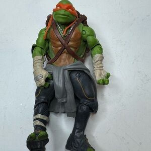 Green and Brown Reptile Action Figure